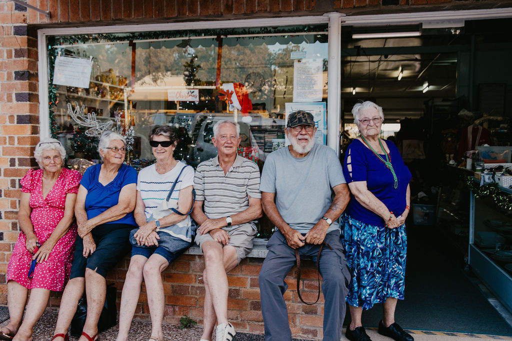 L-R: Margaret, Joanne, Mary, Ron, Gary and Shirley downtown during late night shopping.