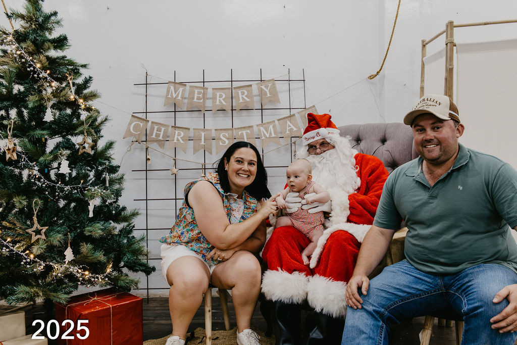 Santa on the job with a first Christmas baby.