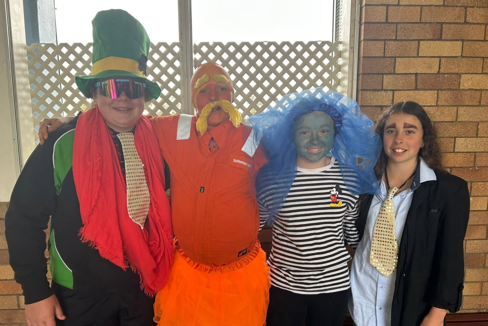 High school students (L-R) Harper, Matilda, Deanna & Natalie were inspired by “The Lorax” by Dr Seuss, and hand-made their costumes to delight and excite the younger students - the makeup did not wash off easily!
