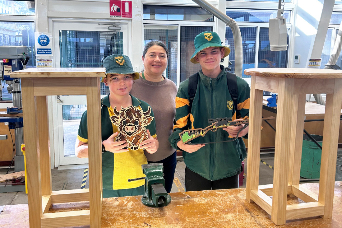 Nevaeh and Blair with Mrs Christidis showing off their Laser cutting job and the mortise and tenon joint side tables they have recently completed.