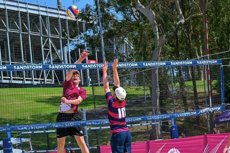 Toby leaping for a block.