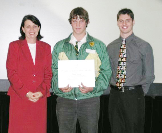 In 2003 at Customs House in Brisbane (L-R): Anna Bligh Minister for Education, Thomas Ramsay (Texas State School student) and Robert Newbery Olympic bronze medalist in diving. Photo courtesy of the Ramsay family.